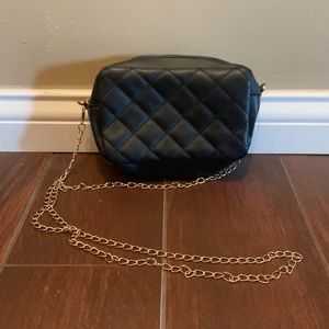 Black cross body purse with gold chain strap
